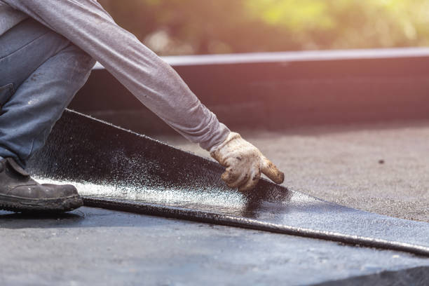 Professional Waterproofing technician working in Lakeville, NY
